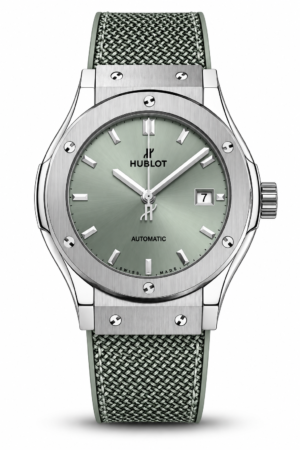 Silver automatic watch with green dial and textured green strap