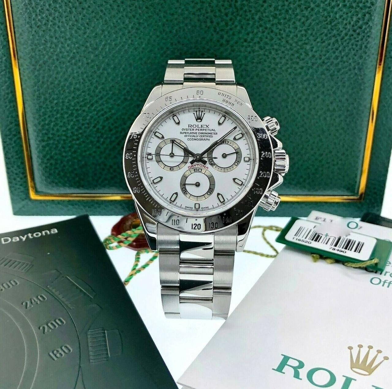 White dial silver chronograph watch with black tachymeter bezel and steel bracelet
